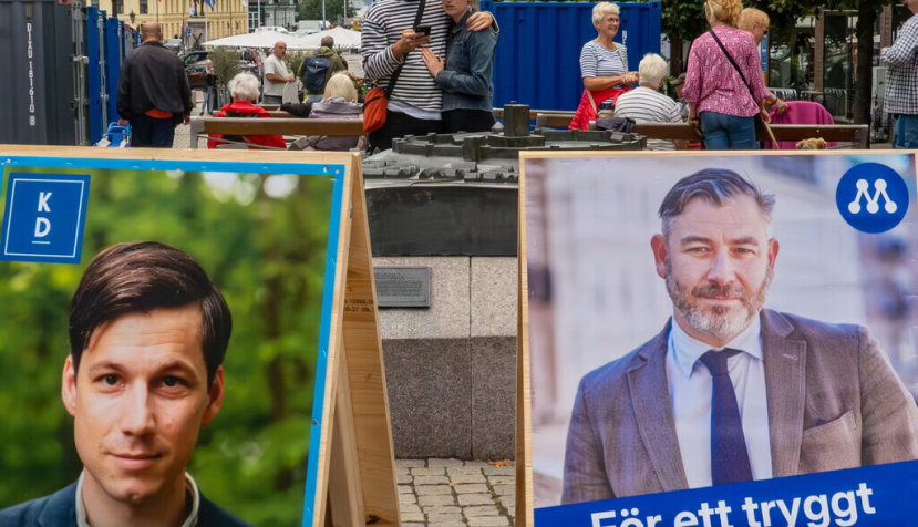 Carteles de los candidatos a las elecciones parlamentarias de Suecia en una calle de la ciudad Helsingborg. Alexanderstock23/Shutterstock