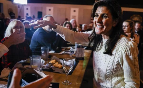 Republican presidential candidate Nikki Haley greets supporters on Jan. 3, 2024, at a bar in Londonderry, N.H. Erin Clark/The Boston Globe via Getty Images
