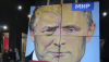 ‘Peace to the World,’ a painting created by a Russian artist, combines the faces of Russian President Vladimir Putin and U.S. President Donald Trump in St. Petersburg, Russia, on March 14, 2025. (AP Photo/Dmitri Lovetsky)