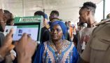 An election official uses the Bimodal Voter Accreditation System to take a picture of a voter during Nigeria’s presidential election. Patrick Meinhardt/Getty Images