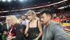 Taylor Swift, flanked by security guards and Donna Kelce, mother of her boyfriend, Travis Kelce, appears at the Super Bowl in February 2024. Julio Cortez/AP