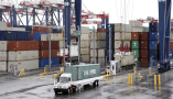 Truck carriers off-load cargo from China and other countries at the Port of Long Beach. Bob Riha, Jr./Getty Images