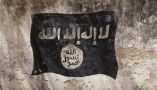 An Al-Shabaab flag on the wall of a former school in Mogadishu in December 2011. Photo by Noe Falk Nielsen/NurPhoto via Getty Images