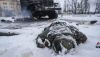 A soldier’s body lies next to a destroyed Russian truck on the outskirts of Kharkiv, Ukraine, on Feb. 25, 2022. AP Photo/Vadim Ghirda