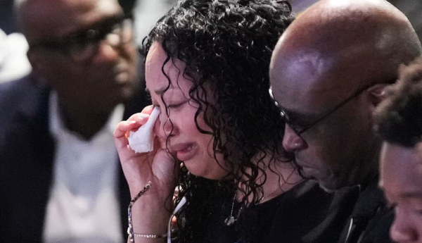 The family of Nolan Wells, during a July 20, 2026, service in Ocean Springs, Miss., for the 18-year-old found dead after taking a July 4 boat trip with friends. AP Photo/Gerald Herbert