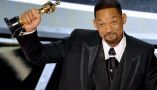 Will Smith accepts an Oscar during the 94th Annual Academy Awards. Neilson Barnard/Getty Images
