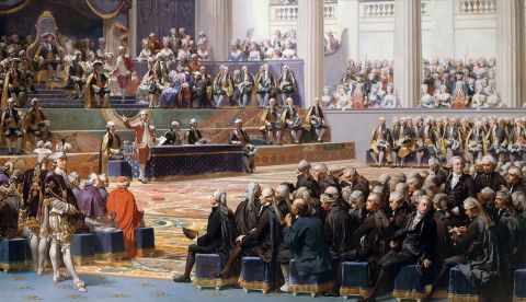 Sesión de apertura de los Estados generales de 1789, el 5 de mayo, en Versalles, según pintura de Auguste Couder. Preside Luis XVI y habla Necker. Se identifican muchos de los participantes.