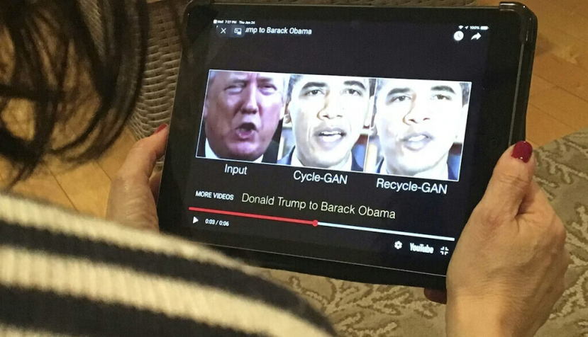 A woman views a manipulated video in January 2019 that changes what is said by President Donald Trump and former President Barack Obama, illustrating how deepfake technology can deceive viewers. Robe LeverAFP via Getty Images