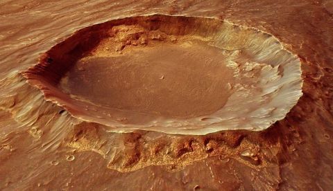 Imagen facilitada por la Agencia Espacial Europea (ESA) que mostró hoy el complejo pasado volcánico y tectónico de Marte, así como nuevos signos de interacción de hielo y agua, gracias a la difusión de fotografías tomadas por la sonda Mars Express. EFE