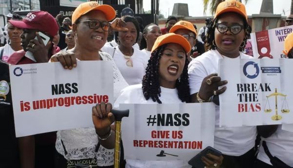  Women holding placards during a protest Women protesting the failure of the gender equality bills on International Women’s Day in 2022. Adekunle Ajayi/NurPhoto via Getty