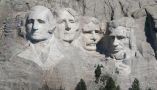 The sculpture of U.S. presidents George Washington, Thomas Jefferson, Theodore Roosevelt and Abraham Lincoln towers over the Black Hills at Mount Rushmore, near Keystone, S.D. Scott Olson/Getty Images News via Getty Images