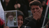A mourner holds a picture of Iranian Supreme Leader Ayatollah Ali Khamenei following his death at Enqelab Square in Tehran, Iran. Abedin Taherkenareh/EPA