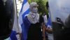  Policías frente a manifestantes nicaragüenses Managua, abril de 2018. Imagen de las protestas que desataron una ola de represenión y el exilio de jóvenes. Evelyn Flores, Author provided (no reuse)