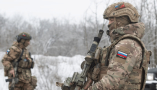 Russian army special forces inspect vehicles at a checkpoint in Zaporizhzhia, Ukraine, in February 2024. Sergey Nikonov/Shutterstock