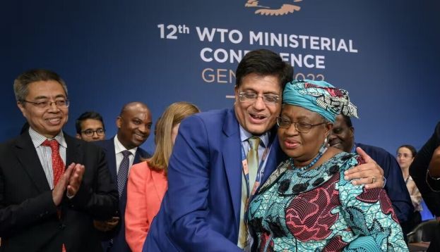 India’s minister of commerce Piyush Goyal and WTO director-general Ngozi Okonjo-Iweala celebrate the end of the WTO’s 12th Ministerial Conference. Fabrice Coffrini/Pool/Keystone via AP
