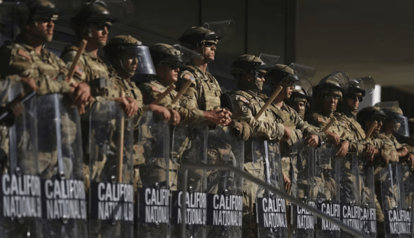 California National Guard troops stand in front of a federal building in Los Angeles on June 10, 2025. AP Photo/Eric Thayer