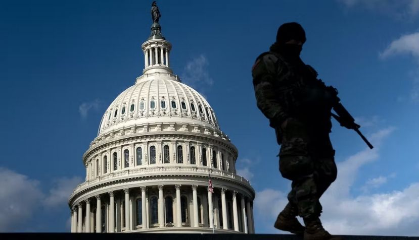 A member of the National Guard patrols the U.S. Capitol on March 4, 2021. Brendan Smialowski/AFP via Getty Images