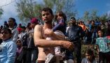 A Venezuelan asylum-seeker carries his daughter before they cross the Rio Grande into Brownsville, Texas. Veronica G. Cardenas/AFP via Getty Images