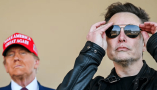 Elon Musk, right, has moved to take the reins of the U.S. government. Brandon Bell/Getty Images