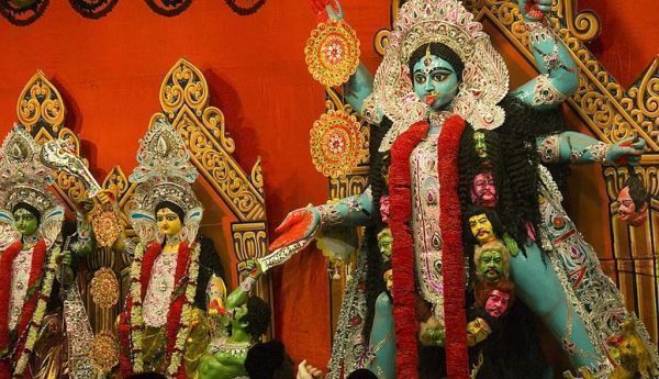 People admire a massive statue of the Hindu goddess Kali. Jerry Redfern/LightRocket via Getty Images