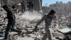 A group of men inspects the ruins of a police station in Tehran, Iran, on March 3, 2026. AP Photo/Vahid Salemi