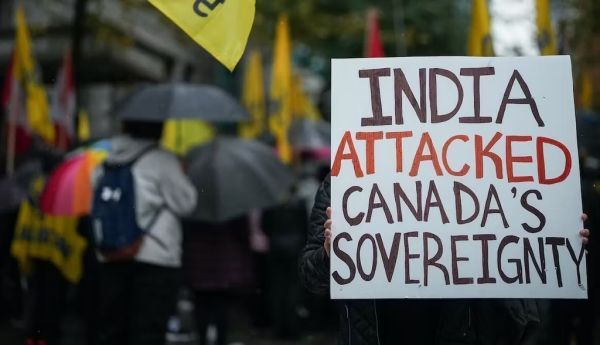 A person holds a sign during a protest outside the Indian consulate in Vancouver in September 2023. THE CANADIAN PRESS/Darryl Dyck