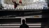 A migrant from Haiti waits with others at a clinic for migrants in Tijuana, Mexico. AP Photo/Gregory Bull