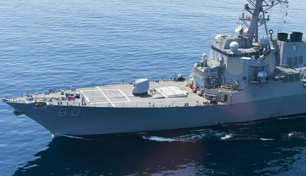 The USS Paul Hamilton is seen after passing through the Strait of Hormuz in May 2023. The strait is one of the busiest and most strategically significant shipping routes in the world. (AP Photo/Jon Gambrell)