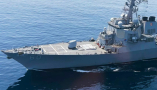 The USS Paul Hamilton is seen after passing through the Strait of Hormuz in May 2023. The strait is one of the busiest and most strategically significant shipping routes in the world. (AP Photo/Jon Gambrell)