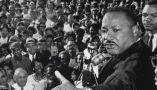 The Rev. Martin Luther King Jr. addresses a cheering crowd in Cleveland, Ohio, on July 27, 1965. Bettmann/Getty Images