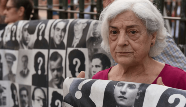 A protester holds a banner with pictures of people who went missing during the Spanish dictatorship of Francisco Franco. John Milner/SOPA Images/LightRocket via Getty Images