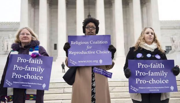 Demonstrators stand outside the Supreme Court in 2014. Saul Loeb/AFP via Getty Images