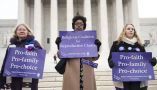 Demonstrators stand outside the Supreme Court in 2014. Saul Loeb/AFP via Getty Images