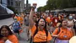 People march in Ottawa during a rally to demand an independent investigation into Canada’s crimes against Indigenous Peoples, including those at Indian Residential Schools on July 31, 2021. THE CANADIAN PRESS/Justin Tang