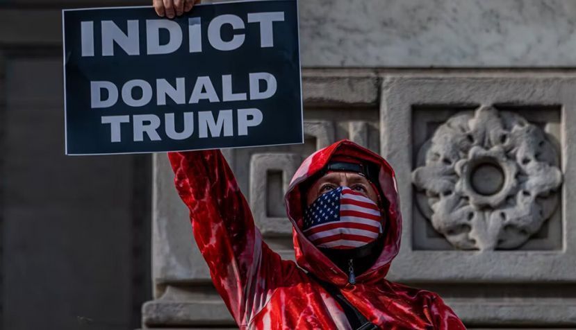 A man protesting in New York City one year after the violent insurrection in Washington, D.C. Erik McGregor/LightRocket via Getty Images