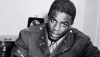 Wearing his military uniform, Jackie Robinson signs a contract on Oct. 23, 1945 to becomes the first Black to play with a white professional baseball team. Bettmann/Getty Images