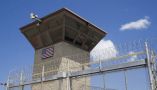 A control tower overlooks the Camp VI detention facility, at Guantánamo Bay Naval Base, Cuba. AP Photo/Alex Brandon