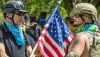 Anti-government protestors use the American flag to draw attention to their cause at a protest on Aug. 8, 2020, in Columbus, Ohio. Paul Becker/Becker 1999 via Flickr, CC BY