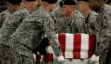 The body of U.S. Army Spc. Israel Candelaria Mejias is carried in a transfer case at Dover Air Force Base in Delaware after he was killed on April 5, 2009, near Baghdad. AFP Photo/Paul J. Richards via Getty Images